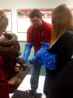 Calving clinic participants practice techniques.